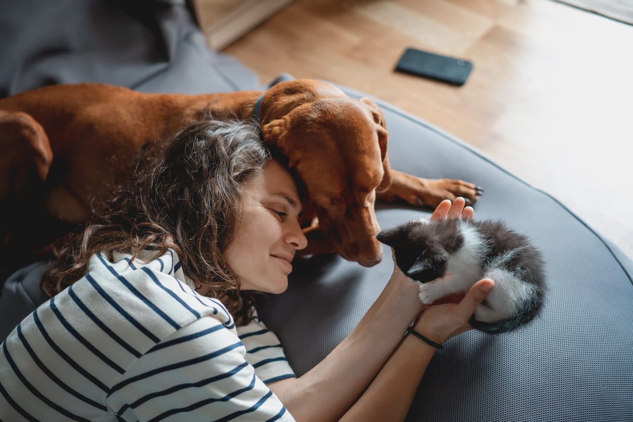 Eurolife blog - Woman with cat and dog at home